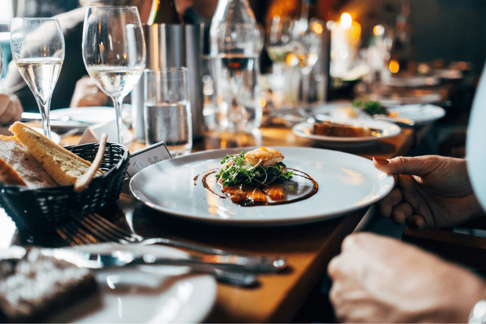 Showing a plate of food and drinks on a busy table in the restaurant
