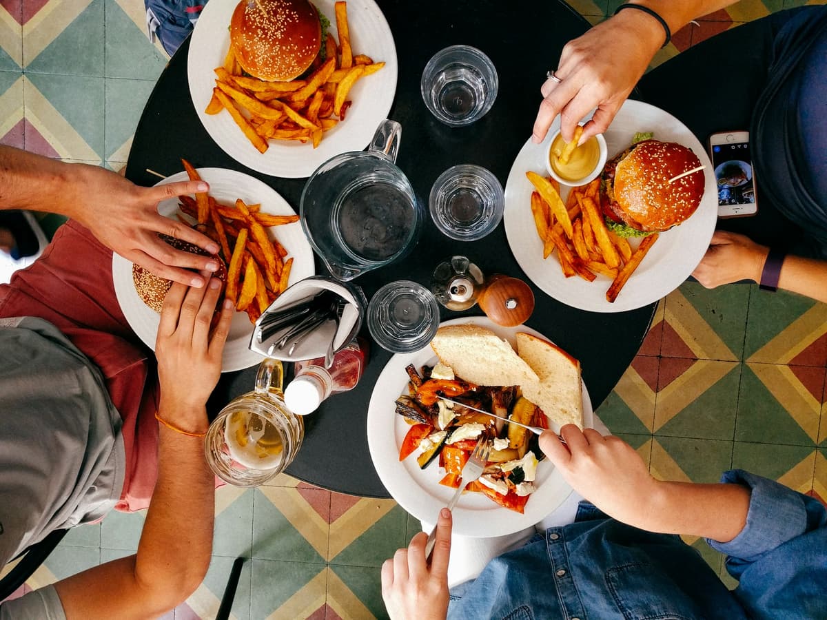 Four delicious meals around a circle table, shown from above